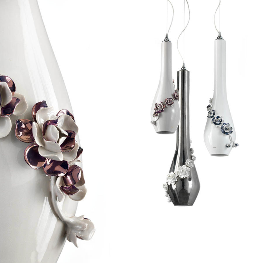 Decorative pendant lamps with floral designs on a white background