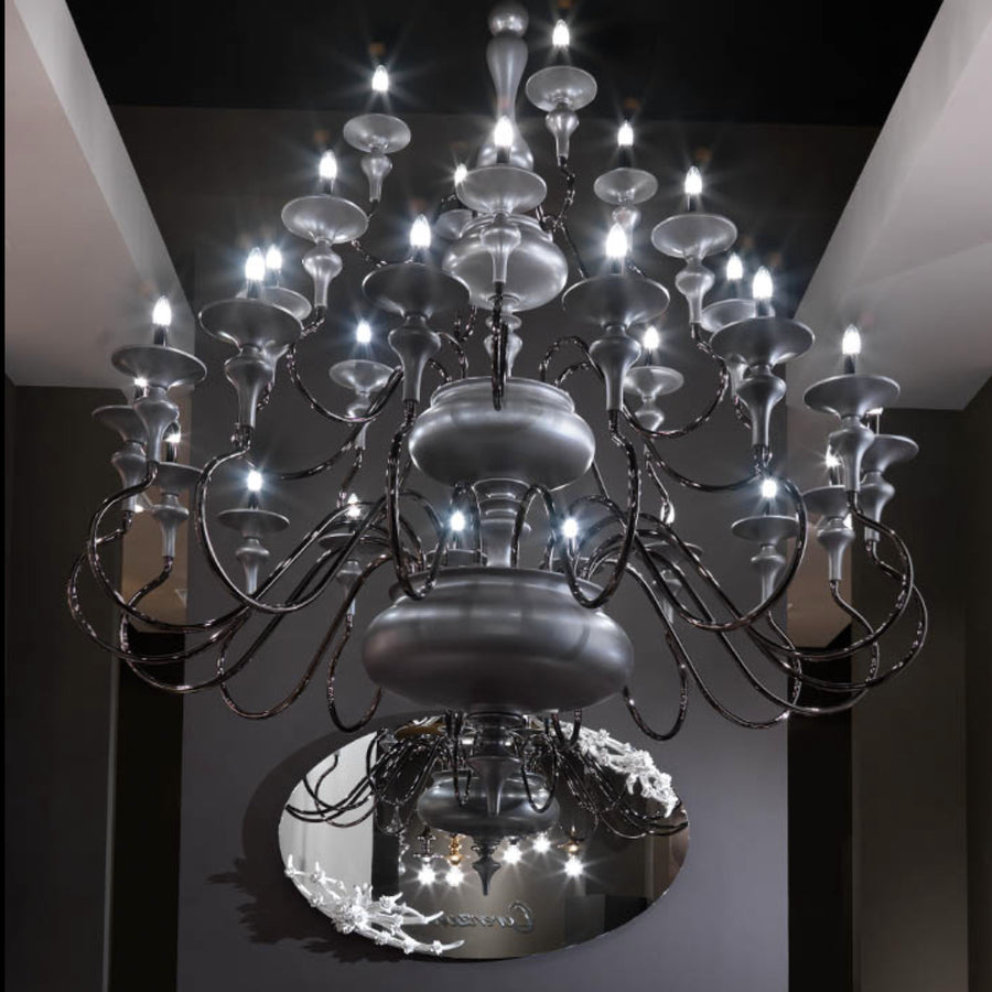 Large chandelier with multiple lights in a dark room