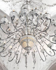 Luxurious ceramic chandelier with crystal accents on a decorative ceiling