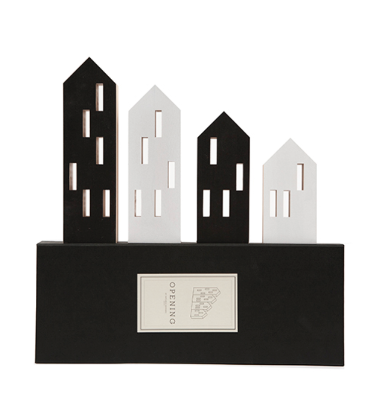 Three ML City Opening B&W (4pc set) black and white buildings on a black beech wood stand. Brand: Madlab.