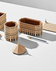 A set of Madlab's ML Utopia Collection Octo Box buildings and a pen on a white surface in Madrid.