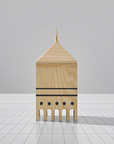 A ML Utopia Collection Square Box by Madlab, handmade out of wood, representing a mosque on a tiled floor.
