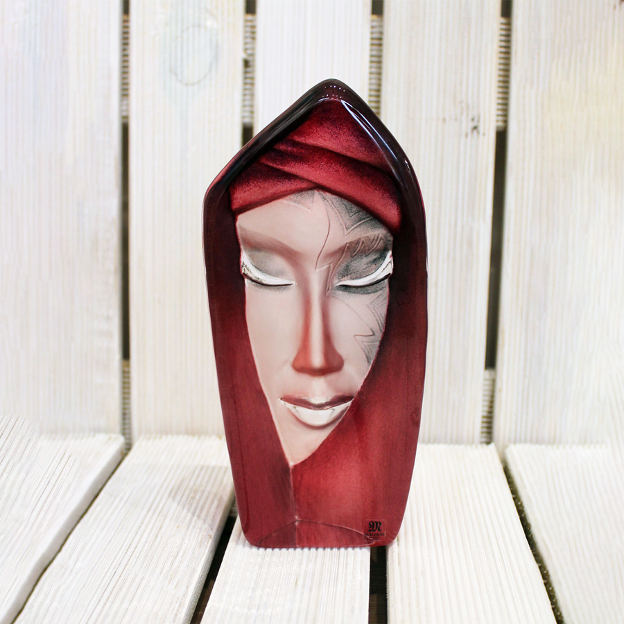 Maleras Crystal Batzeba Red Masq Sculpture on white wooden surface for modern interiors available at Spacio India from Sculpture and Art Objects Collection of Crystal Sculptures.