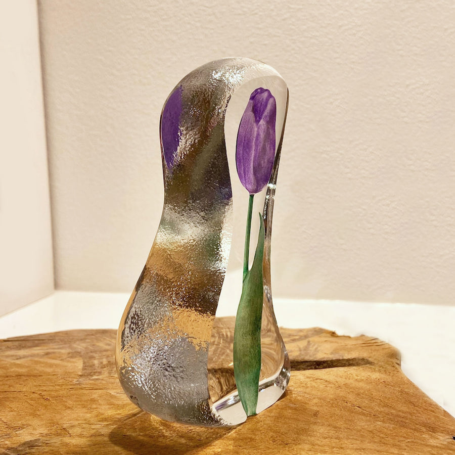 Side look of Maleras Crystal Sculpture Tulip Purple Small on a wooden table top, available at Spacio India from the Sculptures and Art Objects Collection