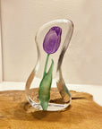 Back look of Maleras Crystal Sculpture Tulip Purple Small on a wooden table top, available at Spacio India from the Sculptures and Art Objects Collection