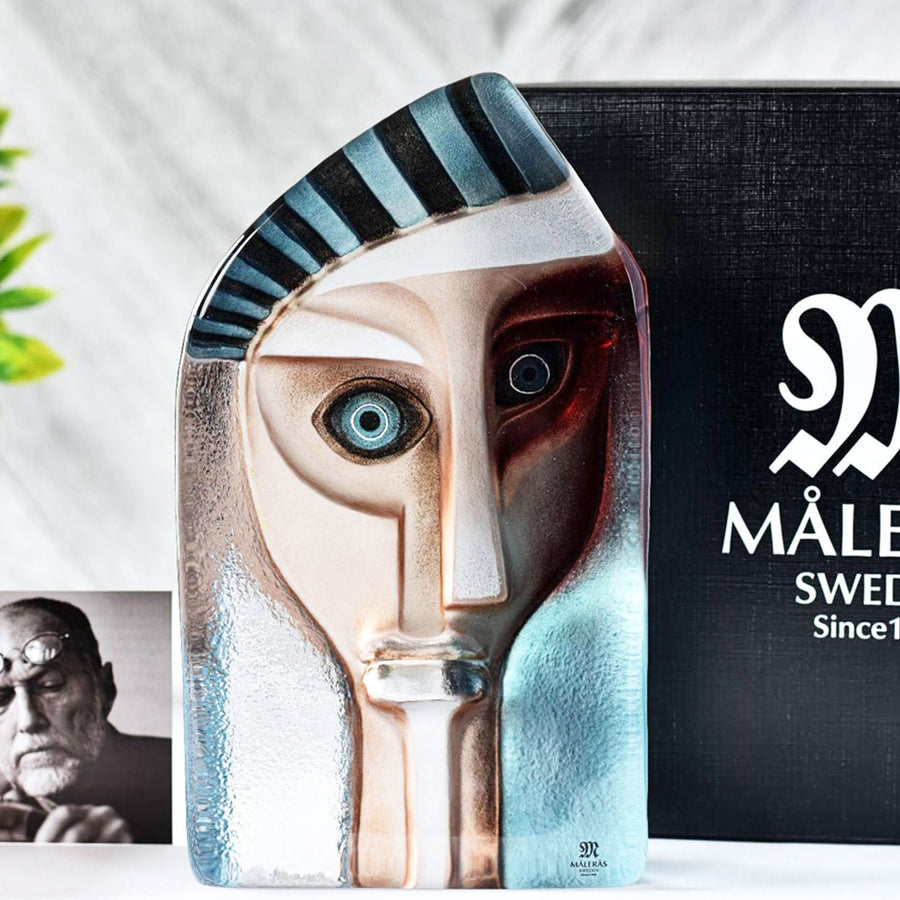 Maleras Crystal Xerxes Sculpture with Mats Jonasson photo and Packaging on a white surface in modern interior available at Spacio India from Sculpture and Art Objects Collection.