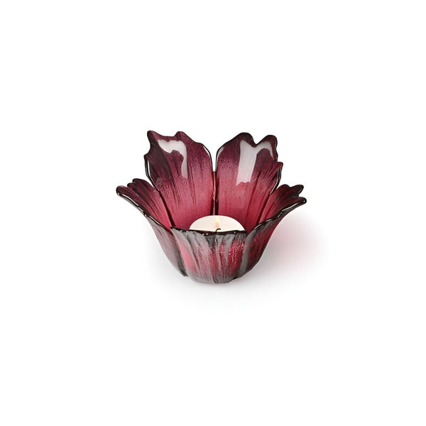 Red glass candle holder on a white background