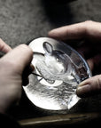 Maleras craftsmen in Sweden engraving a Maleras crystal sculpture in their factory