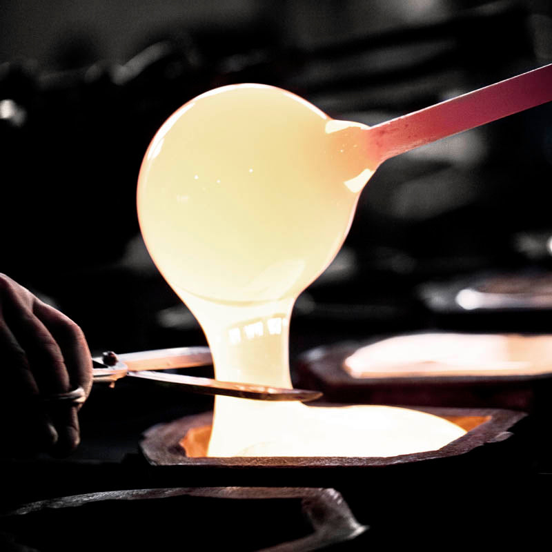 Maleras craftsmen in Sweden working with molten crystal for a Maleras crystal sculpture in their factory