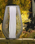 Decorative outdoor solar lamp with striped design on a stone ledge by Les Jardins available at Spacio retail stores in Mumbai & Kolkata. 