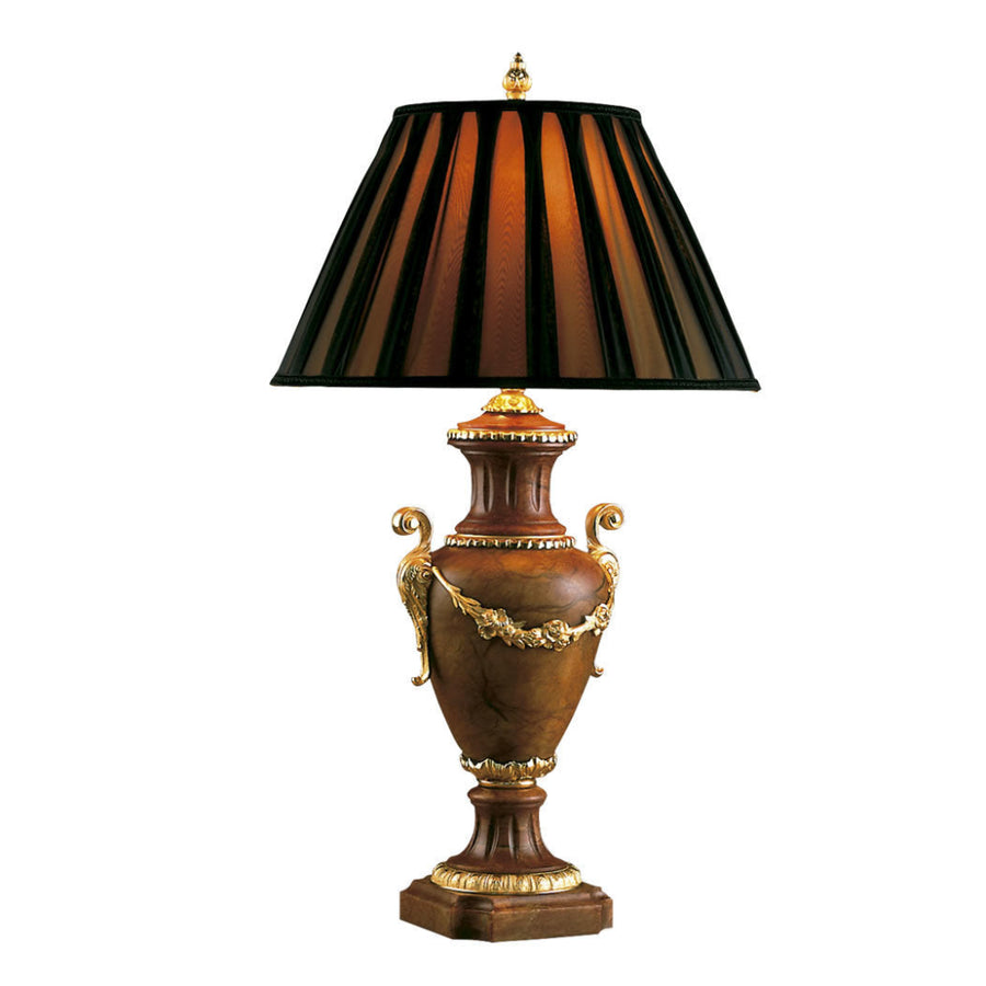 Decorative table lamp made of burgundy alabaster with a striped brown and black shade on a white background
