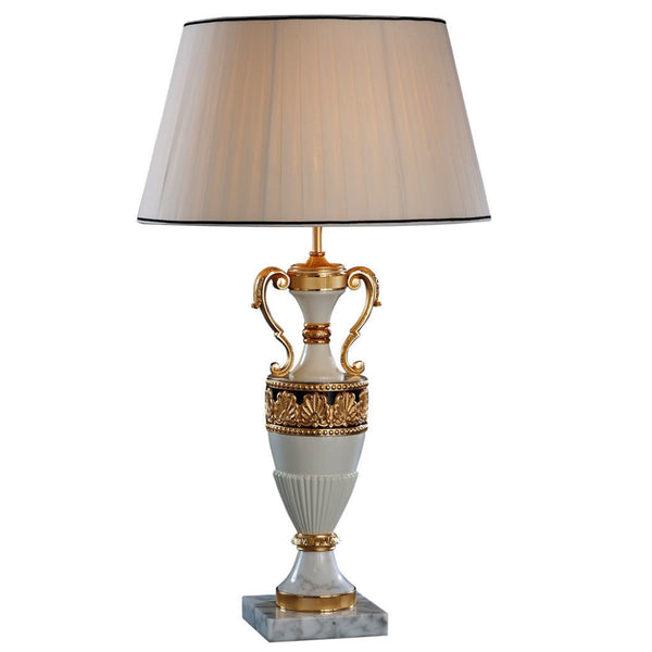 Decorative table lamp with gold accents on a white background made of bronze, alabaster by Mariner, available at Spacio in India. 