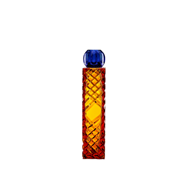 Decorative crystal vase with blue top and orange body on a white background