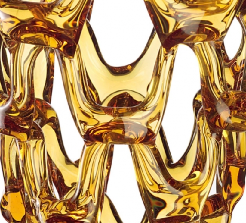 A close up of a Mario Cioni Crystal Arabesque Vase Amber yellow glass vase.