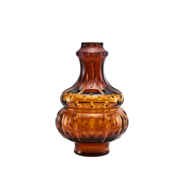 Amber crystal vase with decorative patterns on a white background