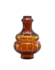 Amber crystal vase with decorative patterns on a white background