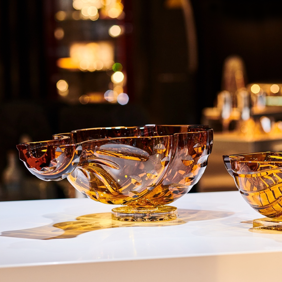 Mario Cioni Crystal Baboda Passion Suspended Bowl on a table with other amber bowls available at Spacio India for luxury home decor accessories collection of Bowls & Centerpieces.