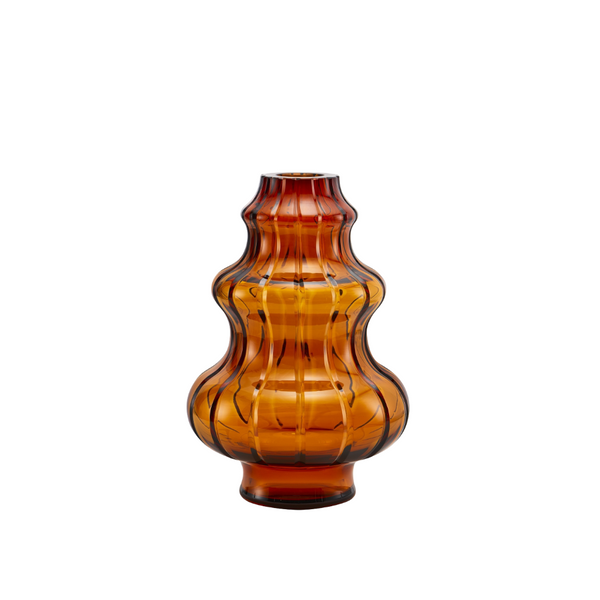 Amber crystal vase with textured design on a white background