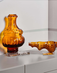 Mario Cioni Crystal Baboda Suspended Bowl with Passion wall vase on a console available at Spacio India for luxury home decor accessories collection of Bowls & Centerpieces.