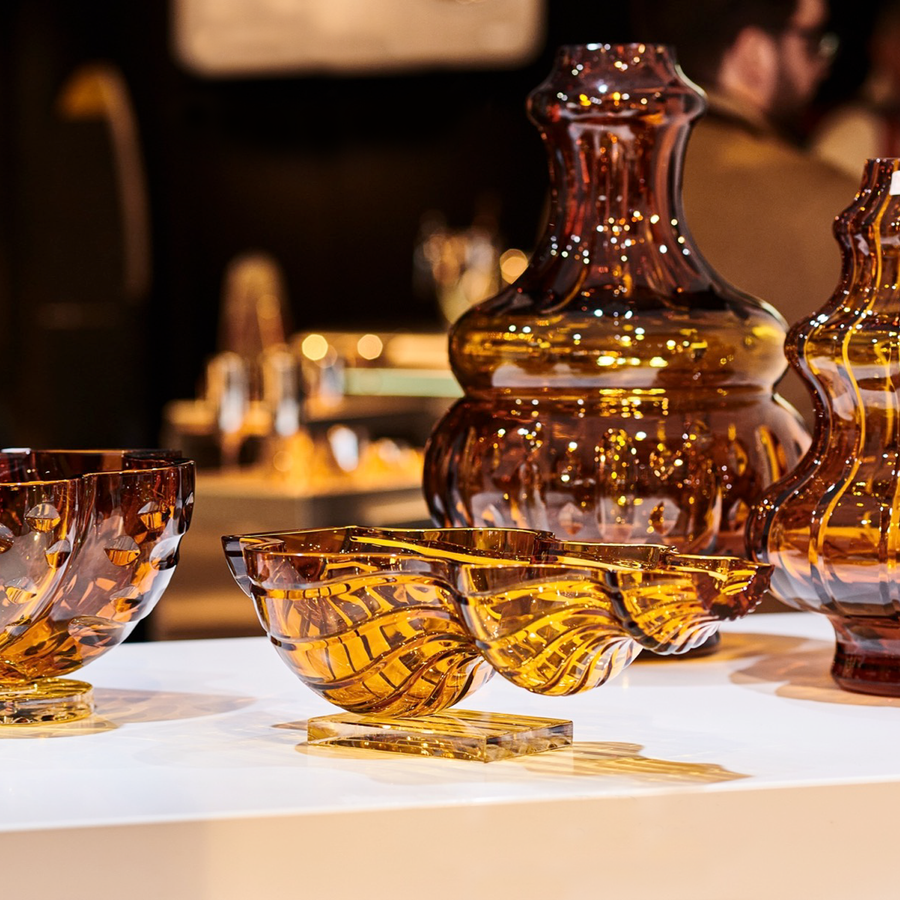 Mario Cioni Crystal Baboda Suspended Bowl on a table with other amber bowls available at Spacio India for luxury home decor accessories collection of Bowls & Centerpieces.