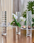 3 cystal cut vases with different cuts styled on a table
