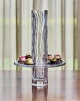 Crystal vase styled with sweets on a table