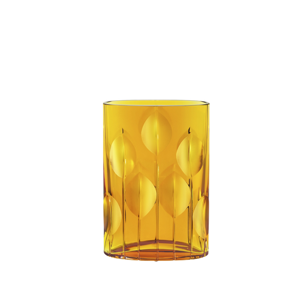 Yellow crystal vase with leaf pattern on a white background