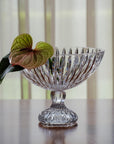 Crystal bowl on a wooden surface with a blurred background