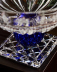 Crystal bowl with blue center on a dark background
