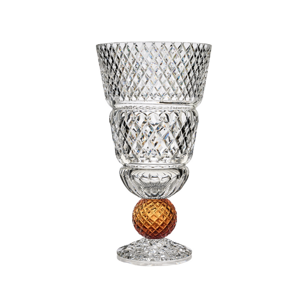 Crystal vase with amber sphere on a white background from Mario Cioni at Spacio store in India. 