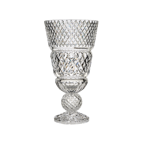 Crystal vase with amber sphere on a white background from Mario Cioni at Spacio store in India. 