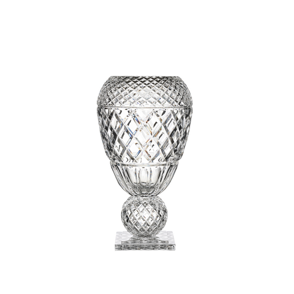 Clear glass vase with diamond cut pattern on a white background