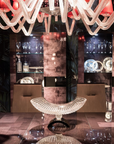 Luxurious interior with a chandelier, glassware, and decorative elements.