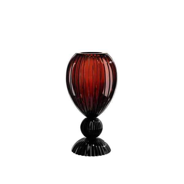 Red and black ribbed crystal vase on a white background