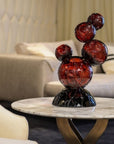 Decorative crystal sculpture on a marble table in a living room setting