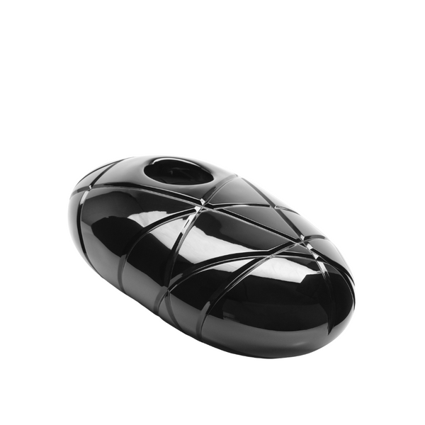Black, oval-shaped sculptural crystal object with a textured surface on a white background