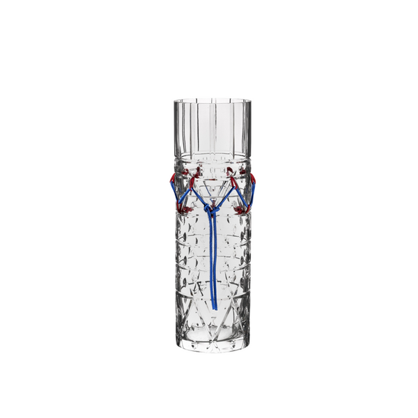 Clear crystal vase with decorative elements on a white background