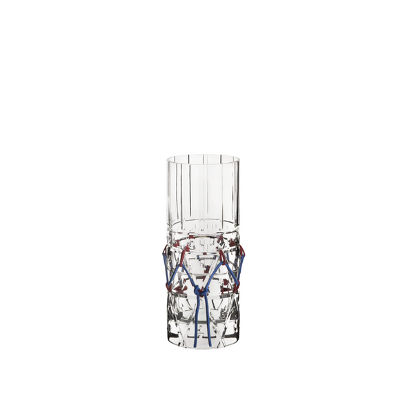 Crystal sculptural vase with red and blue cords on a white background