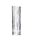 Clear crystal vase with wavy design on a white background