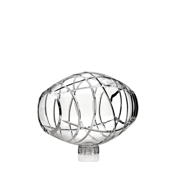 Decorative crystal object with intricate design on a white background