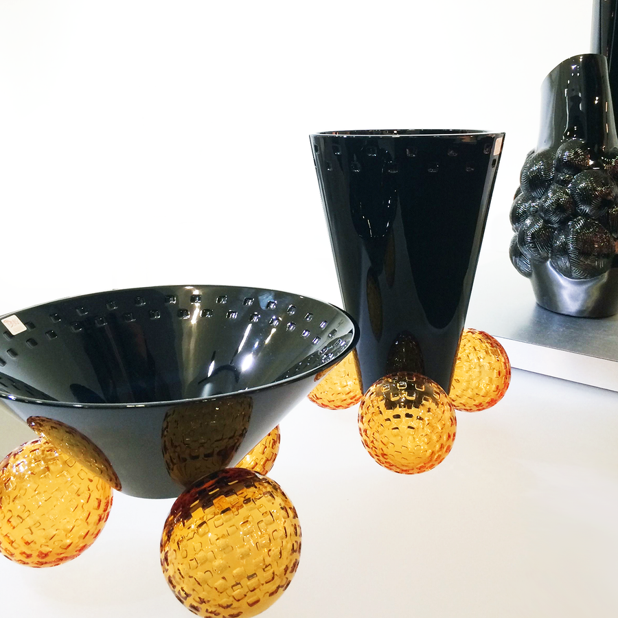 Mario Cioni Crystal Acrobat Black Vase with Amber Spheres by Tondo Doni with Acrobat Bowl on a surface available at Spacio India for luxury home decor accessories collection of decorative Vases. 