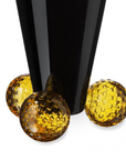 Close look of Mario Cioni Crystal Acrobat Black Vase with Amber Spheres by Tondo Doni on white back ground available at Spacio India for luxury home decor accessories collection of decorative Vases. 