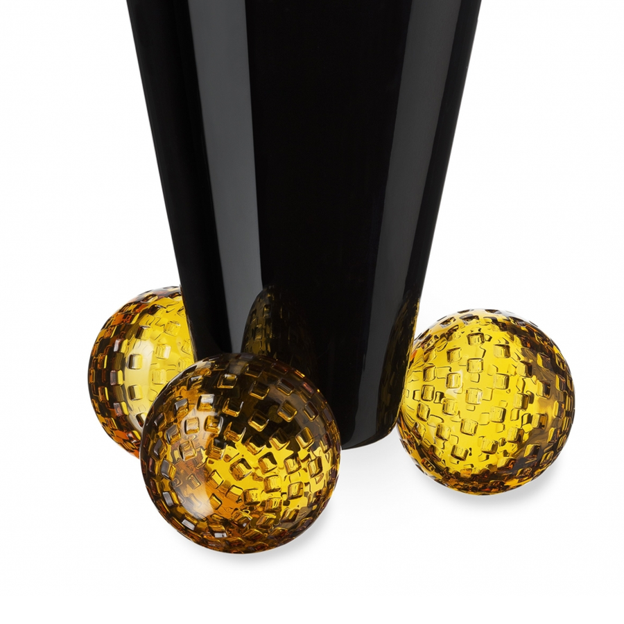 Close look of Mario Cioni Crystal Acrobat Black Vase with Amber Spheres by Tondo Doni on white back ground available at Spacio India for luxury home decor accessories collection of decorative Vases. 