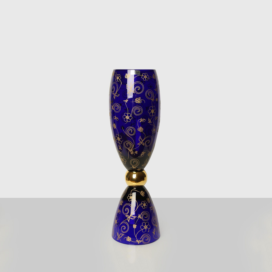 Close right look of Mario Cioni Crystal Blue Small Vase Gold Flowers on Grey Surface available at Spacio India for luxury home decor accessories collection of Vases.