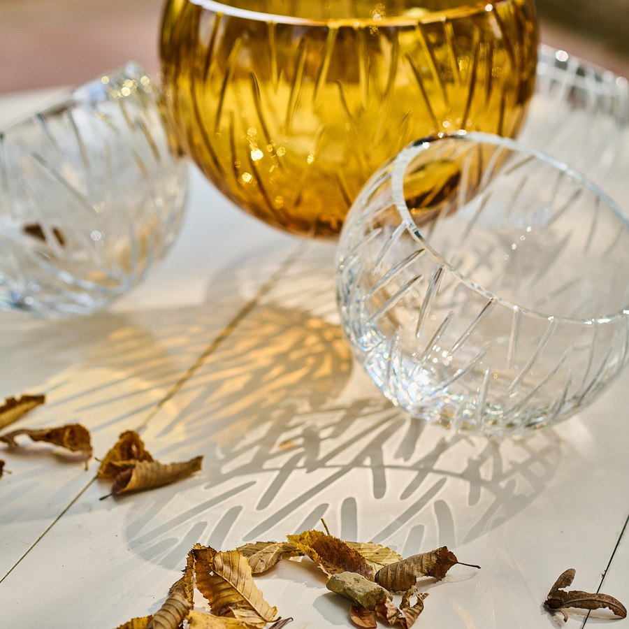 Details & reflection patterns of Mario Cioni Crystal Nova with 4 bowls elements on coffee table available at Spacio India for luxury home decor collection of decorative bowls.