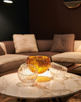 Mario Cioni Crystal Nova with 4 bowls elements on coffee table with warm ambiance of living room available at Spacio India for luxury home decor collection of decorative bowls.