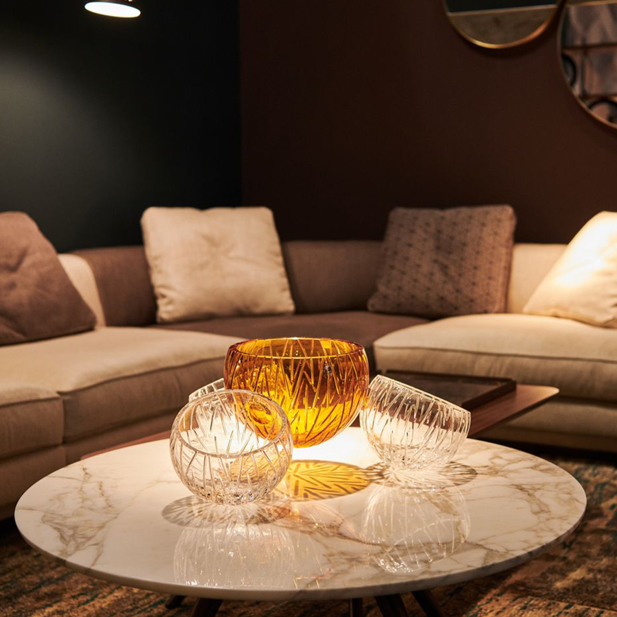 Mario Cioni Crystal Nova with 4 bowls elements on coffee table with warm ambiance of living room available at Spacio India for luxury home decor collection of decorative bowls.