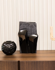 Mario Cioni Metropolis Black Crystal Vase by Tondo Doni on a console table styled with other black vase available at spacio india for luxury home decor collection of decorative vases.