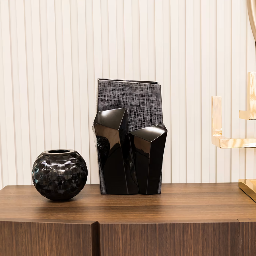 Mario Cioni Metropolis Black Crystal Vase by Tondo Doni on a console table styled with other black vase available at spacio india for luxury home decor collection of decorative vases.