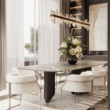 Modern dining room with a marble table and white chairs and an onyx chandelier by Masiero available at Spacio retail stores in Mumbai & Kolkata. 